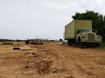 Built structure on field against sky