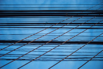 Low angle view of office building against blue sky