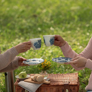 Close-up of hand holding drink in basket