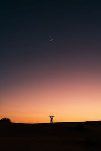 Silhouette landscape against sky during sunset