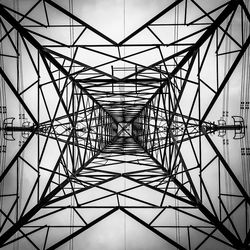 Low angle view of electricity pylon against sky