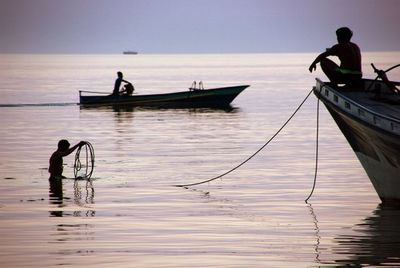 People on boat in sea