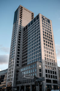 Low angle view of modern buildings against sky