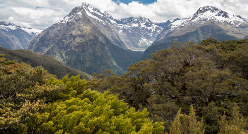 Scenic view of snow covered mountains against sky