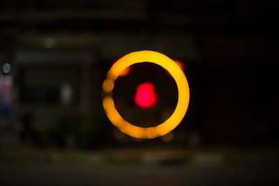 Close-up of illuminated electric lamp at night