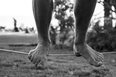 Low section of man holding stick