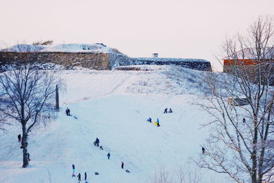 High angle view of people on snow covered landscape