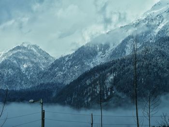 Scenic view of snowcapped mountains against sky