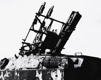 Low angle view of crane against clear sky