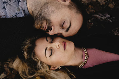 Close-up of smiling woman with eyes closed