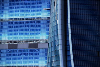 Modern office building against blue sky