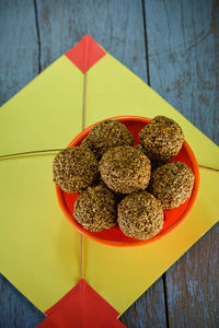 Sesame laddu in bowl, makar sankranti festival concept