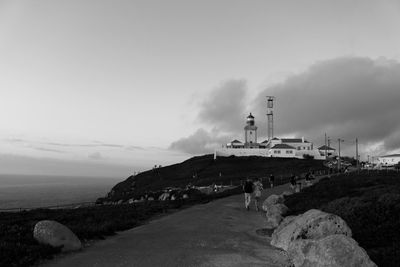 View of rocks against cloudy sky