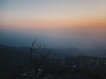 Scenic view of landscape against sky during sunset