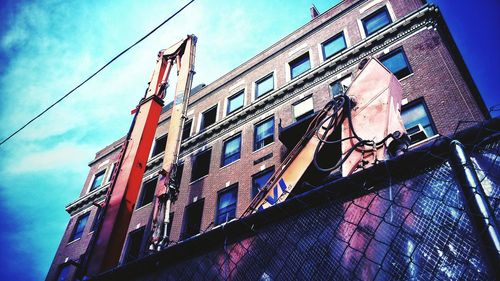 Low angle view of building against blue sky