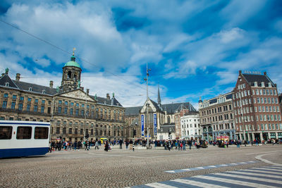 Dam square and the royal palace at the old central district of amsterdam in a cold early spring day