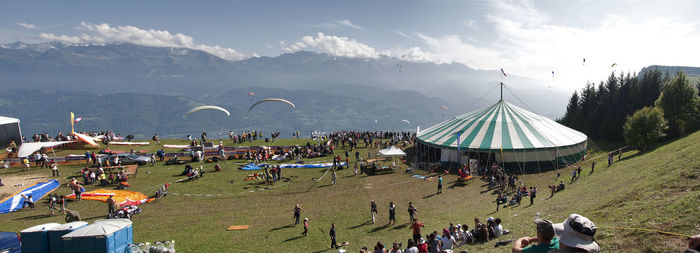 Group of people on shore against sky