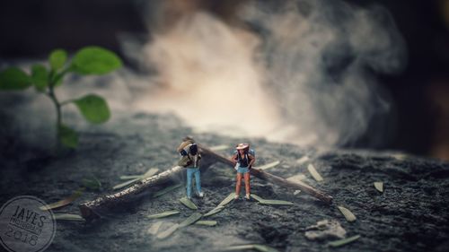 Close-up of men standing on wood