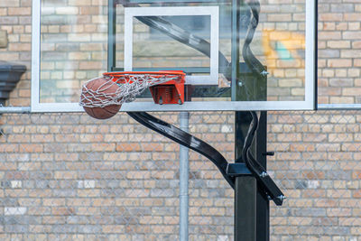 View of basketball hoop against building