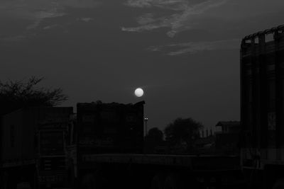 Buildings in city at sunset