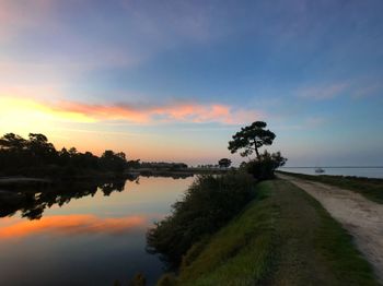 Scenic view of landscape against sky at sunset