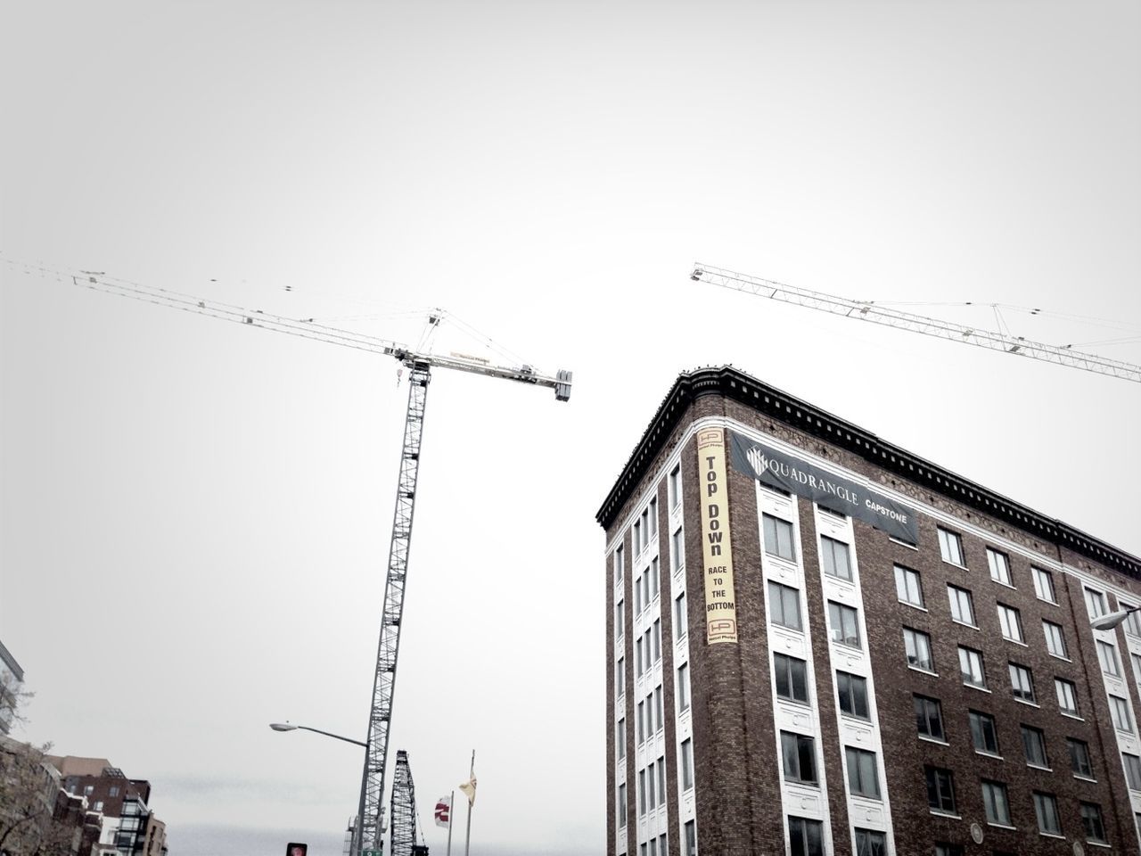 building exterior, architecture, built structure, low angle view, clear sky, crane - construction machinery, development, city, construction site, construction, copy space, crane, tall - high, building, day, outdoors, sky, flying, no people, incomplete