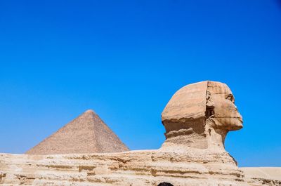 Ancient temple against clear blue sky