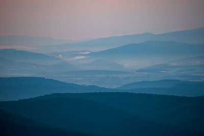 Scenic view of mountains against sky during sunset