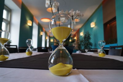 Close-up of hourglass on table at restaurant