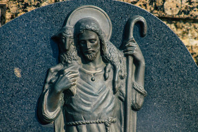 Close-up of angel statue in cemetery