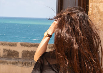 Rear view of woman looking away