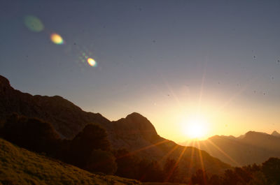 Scenic view of mountains against sky during sunset