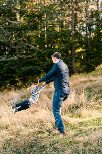 Full length of boy standing on field