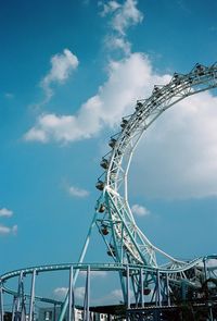 Low angle view of ferris wheel against sky