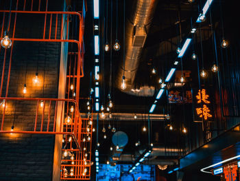 Low angle view of illuminated buildings at night