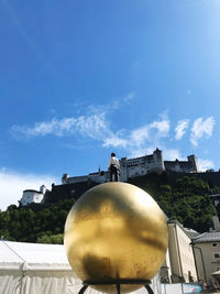 Low angle view of building against cloudy sky