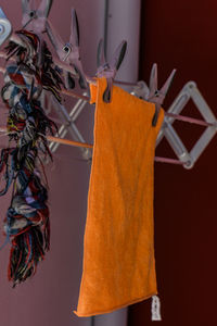 Close-up of clothespins hanging on clothesline