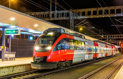 Train at railroad station at night