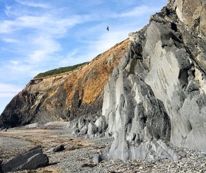 Low angle view of rock formations against sky