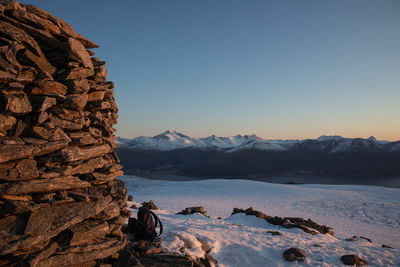 Scenic view of mountains against clear sky during winter