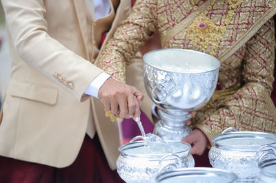 Midsection of woman holding drink