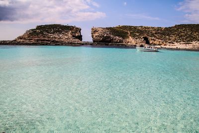 Scenic view of sea shore against sky