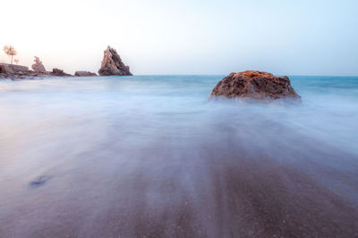 Scenic view of sea against clear sky