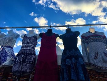 Close-up of clothes hanging in store for sale