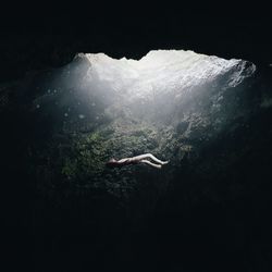 High angle view of woman swimming in sea