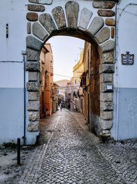 Alley amidst buildings in city