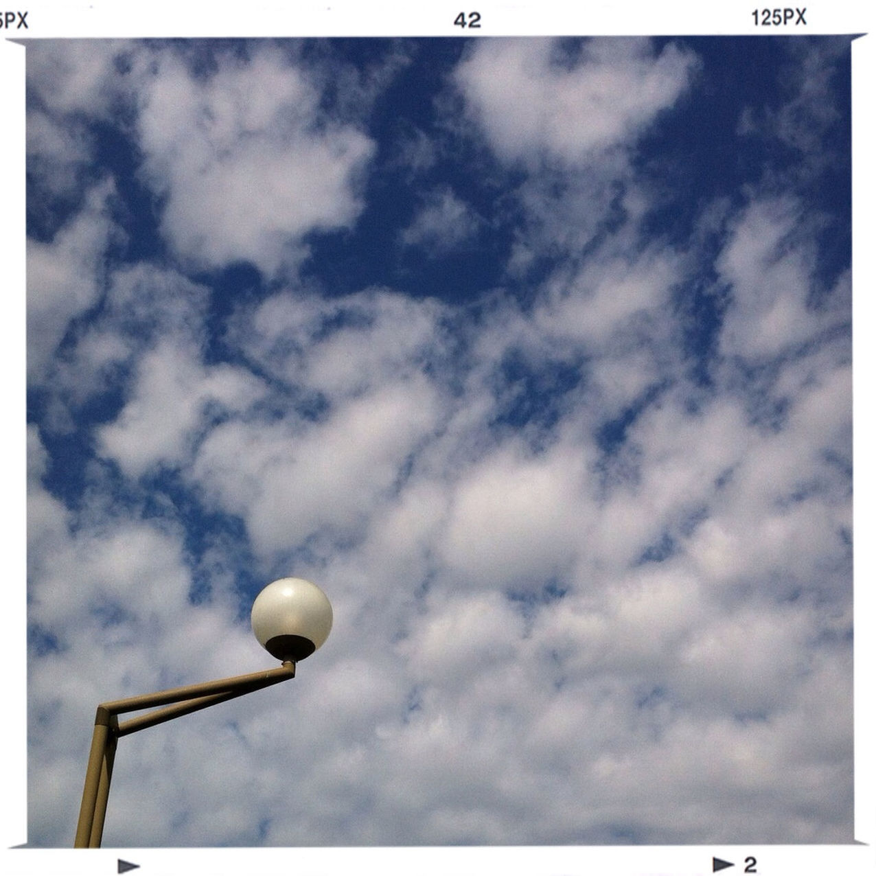 low angle view, sky, cloud - sky, cloudy, cloud, transfer print, overcast, street light, auto post production filter, weather, nature, outdoors, no people, tranquility, day, lighting equipment, high section, beauty in nature, cloudscape, scenics