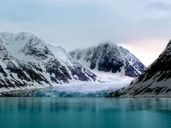 Scenic view of frozen lake against sky