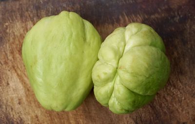 Close-up of green fruit on table