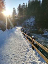 Scenic view of snow covered land against sky